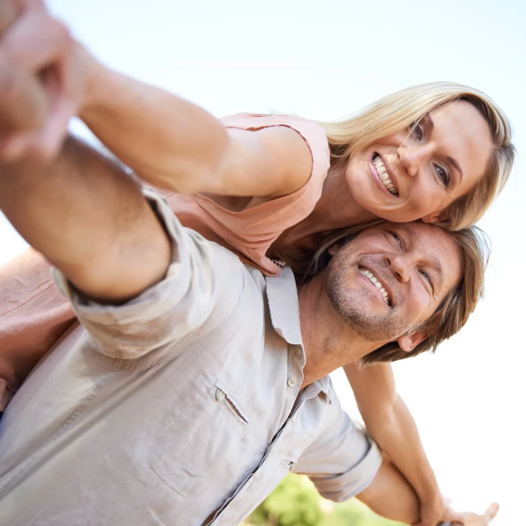 shot of a happy mature enjoying a piggyback ride o utc
